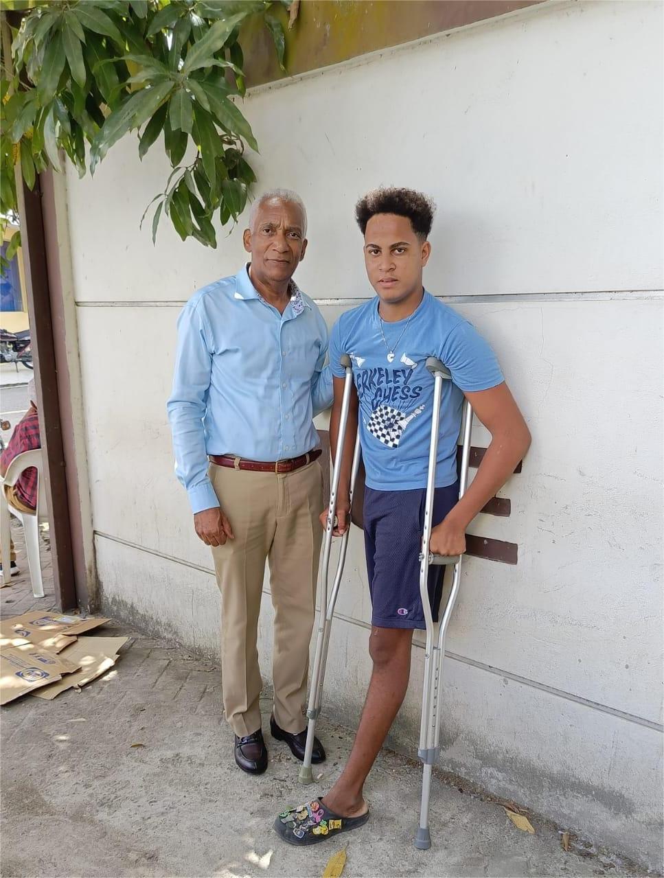 A Young Man Receives His Crutches